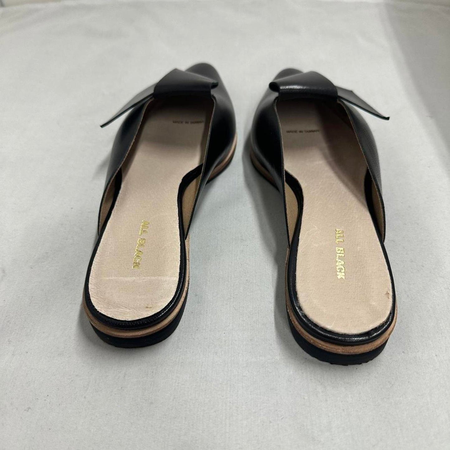 Contemporary Chic Black Leather Half Bow Mule Slides (6.5)