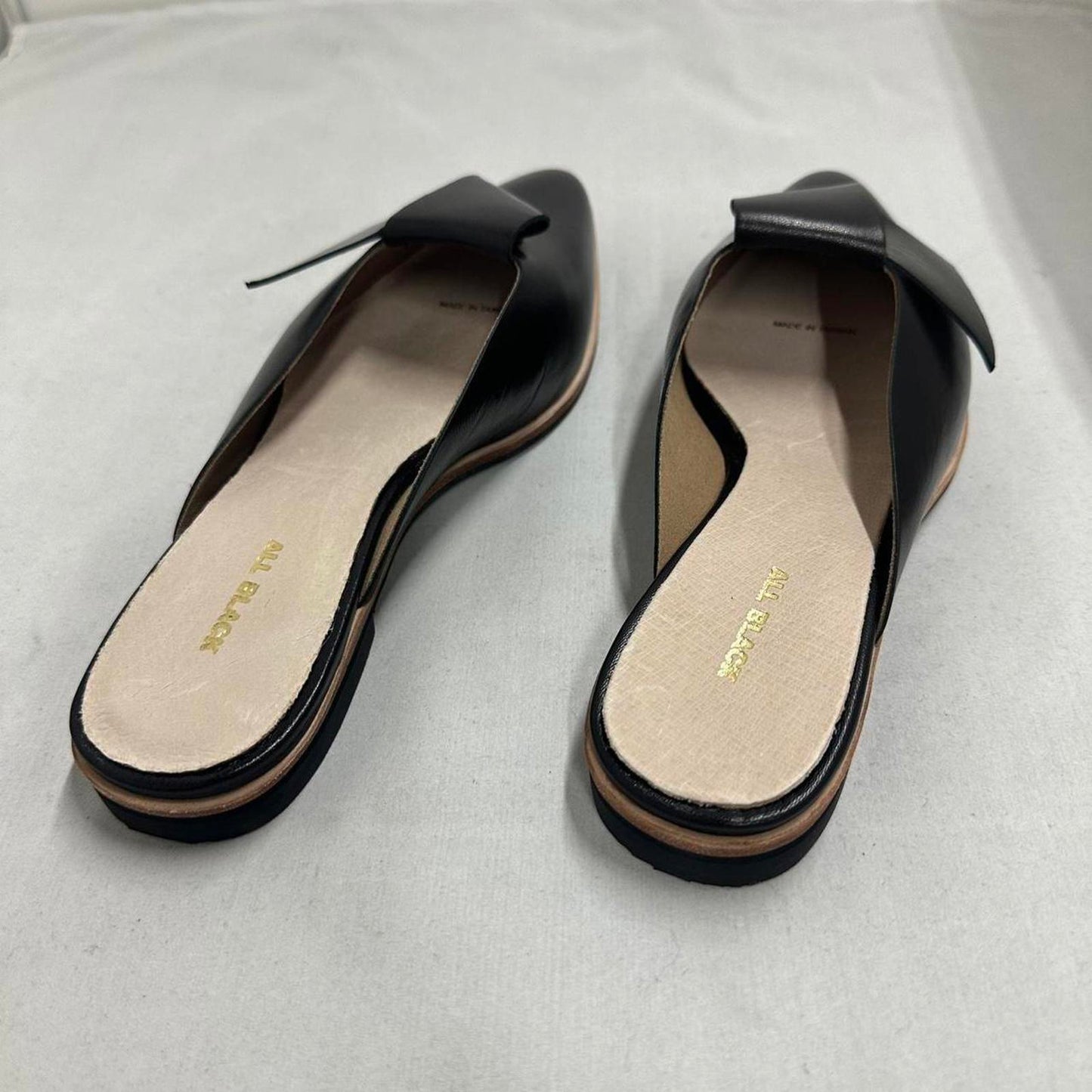 Contemporary Chic Black Leather Half Bow Mule Slides (6.5)