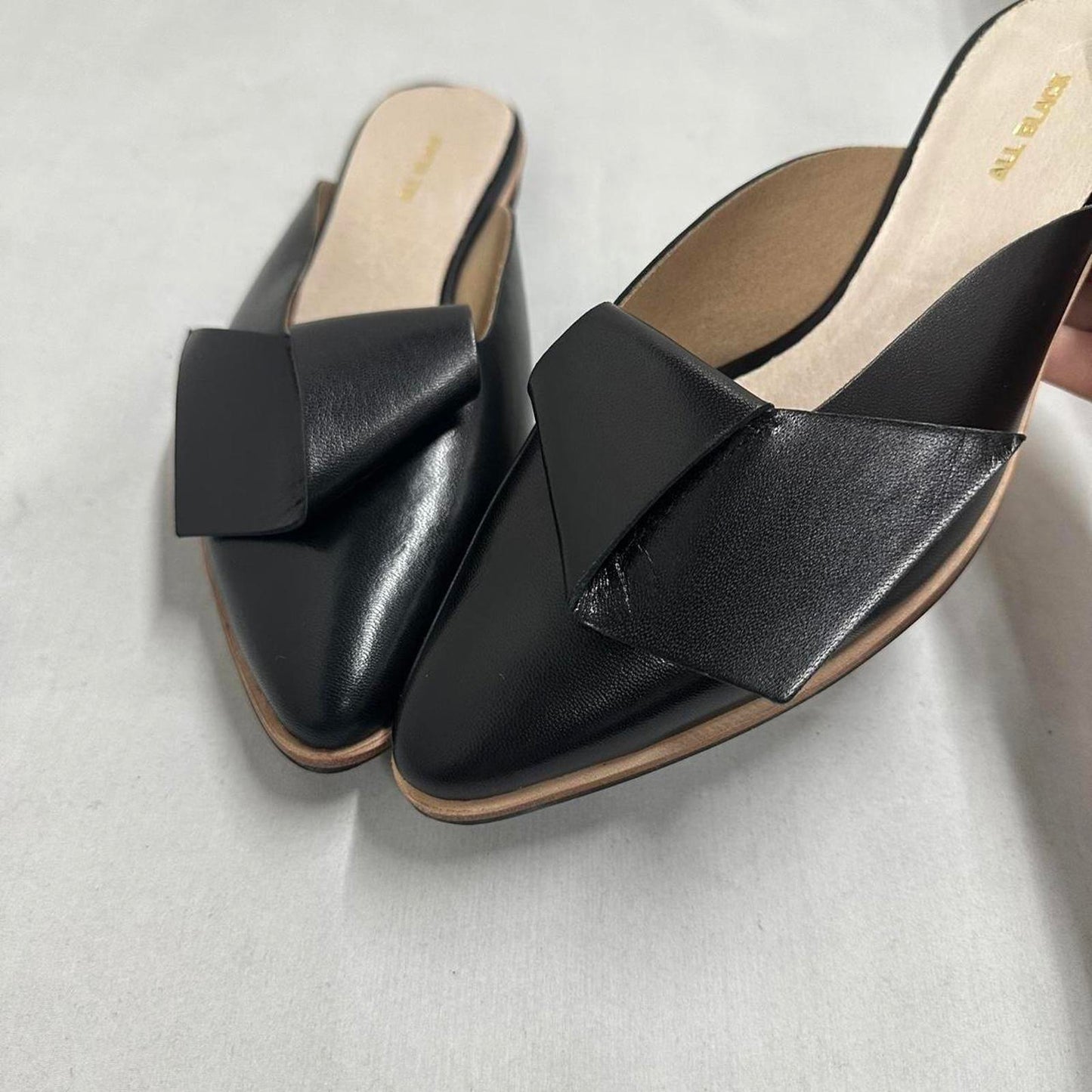 Contemporary Chic Black Leather Half Bow Mule Slides (6.5)